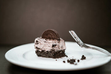 Half eaten cookies and cream cheesecake