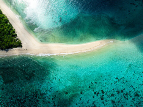 Inshore waves on sandy beach and white sandbar. Romblon Island. Romblon, Philippines.
