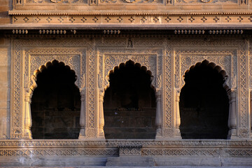 Fototapeta na wymiar 24 February 2024, Exterior View of the scenic tourist landmark Maheshwar fort (Ahilya Devi Fort ) in Madhaya pradesh, India, Beautiful sculptures Carving details on the outer wall.