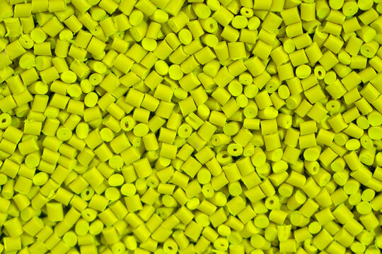 The pile of green pellets materials for plastic injection process.