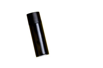 Black spray can isolated on yellow background. Mockup. Can concept. Beauty product concept. Space for text. Mockup.