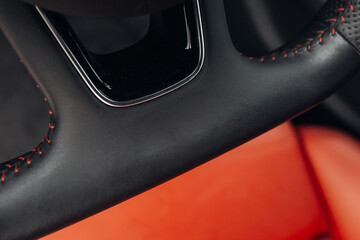 Modern car sport steering wheel close up