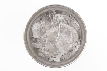 Top view of Ice in a blue stainless steel cold storage glass on a white background.