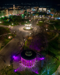 Aerial drone view of  spianada square in corfu town with purple Venetian Lights during greek easter