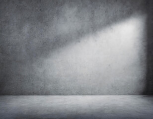 Open space of a large room with gray walls and gray floor, light from the window on the right on the wall