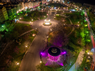 Aerial drone view of  spianada square in corfu town with purple Venetian Lights during greek easter