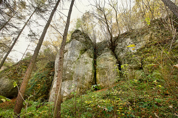 Autumn landscape with picturesque rocks in the forest. Nature of Poland