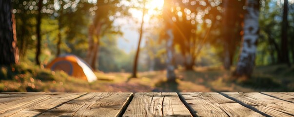 Naklejka na ściany i meble Wooden table on blurred camping background 