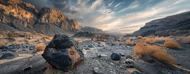 Poster A panoramic view of an alien-like landscape at sunset, featuring towering rocky formations and golden vegetation. © Valeriy