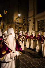 Hooded penitents during the famous Good Friday procession in Chieti (Italy) with the luminous lantern - 778980148
