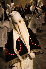 Hooded penitents during the famous Good Friday procession in Chieti (Italy) with their hoods pulled - 778980511