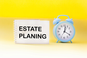 Sticker with the text Estate Planning. Clock on a yellow background. Business concept