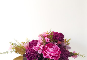 Floral arrangement in different tones of pink isolated on light background with copy space 