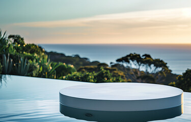 Fototapeta na wymiar A closeup shot of an elegant white circular table with rounded edges placed near a pool, overlooking nature and the sea at sunset in front of the Australian cliffside. For product display montage.