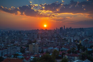 Obraz premium A solar eclipse over a cityscape where the Moon blocks out the Sun, leaving only the dazzling glow of the sun's corona. Concept: urban studies and the influence of astronomical events in the city