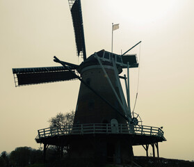 dutch windmill at sunset