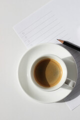 Monday Work Planning. Cup of Coffee on Office Desk with Blank To Do List and Pencil. Business Mockup, Coffee Break.