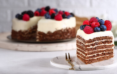 birthday cake with fresh berries and macarons