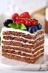 birthday cake with fresh berries and macarons