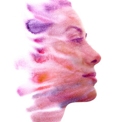 A woman's profile disappearing into a watercolor painting in paintography - 779033308