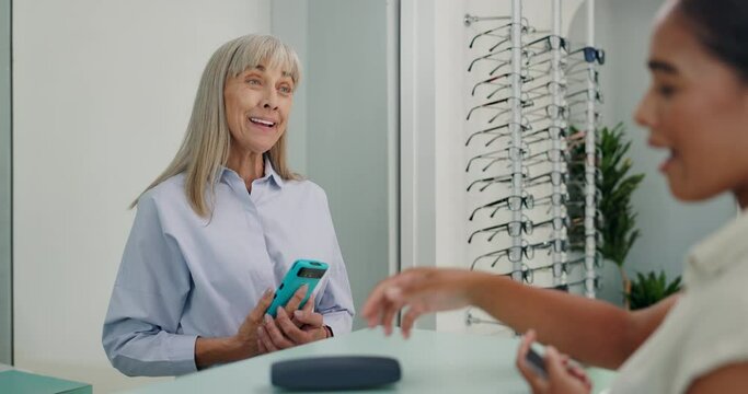 Shopping, glasses or optician of customer for payment, retail service and eye care with pos in checkout. Tap, financial and doctor with woman or client for purchase, transaction and fintech machine