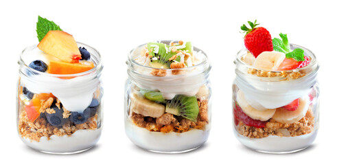 Variety of healthy greek yogurt and fruit parfaits in mason jars isolated on a white background. Peach blueberry, kiwi banana and strawberry banana. - 779043506