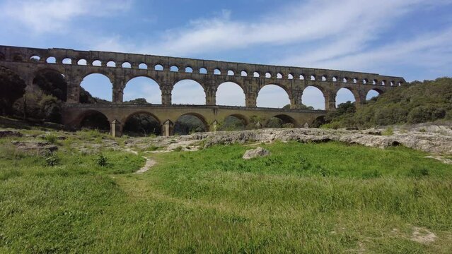 Ancient Roman aqueduct, Pont du Gard, under a clear blue sky in picturesque Provence, near Nimes city in France