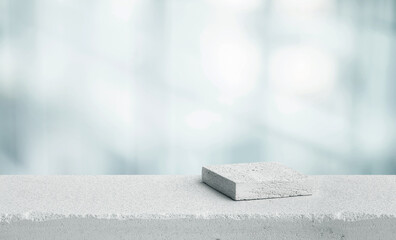 Selective focus.top sandstone product display platform in white color