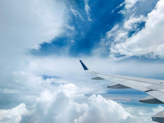 A Spectacular Cloudscape Through the Aircraft Window - obrazy, fototapety, plakaty