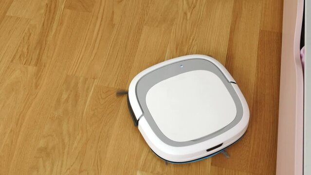 Vacuum cleaner robot polishing the floor
