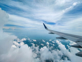 Fototapeta na wymiar A Spectacular Cloudscape Through the Aircraft Window