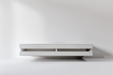 Obraz premium Minimalist white floating TV shelf against white wall