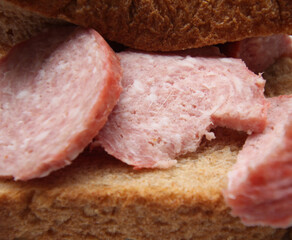 salami sandwich. bread with salami. food with selective focus.