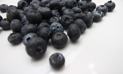 blueberries on a plate. group of blueberries. natural food. set of small fruits. food with selective focus.