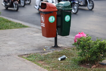 Trash cans outside park in Saigon, Vietnam on March 4, 2024
