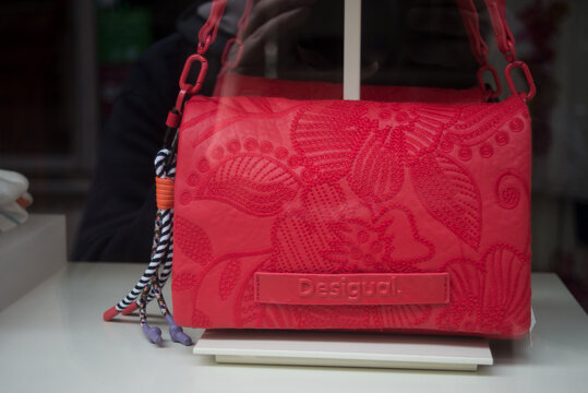 Strasbourg - France - 6 April 2024 - closeup of red desigual handbag in a fashion store showroom