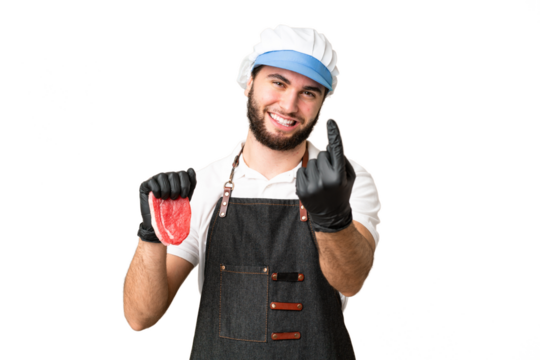 Butcher man wearing an apron and serving fresh cut meat over isolated chroma key background doing coming gesture