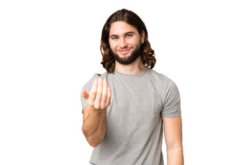Young handsome man over isolated chroma key background inviting to come with hand. Happy that you...