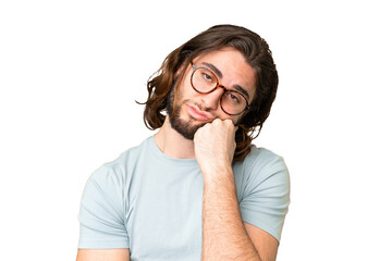 Young handsome man over isolated chroma key background With glasses and with sad expression