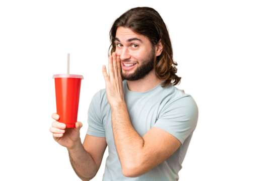 Young handsome man holding soda over isolated chroma key background whispering something