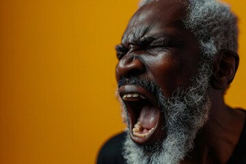 Expression of furious, enraged afro man with grumpy grimace on his face, mouth opened in shout, ready to argue and swear, wants to gain respect, Angry black man yelling, screaming on yellow background - obrazy, fototapety, plakaty