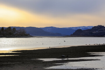 Spring in Norway, sunset at Trondheim fjord and river Gaula