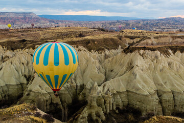 Kapadokya, Turkey - March 23 2014: Early sun rise Kapadokya hot air ballon tour in the red valley...
