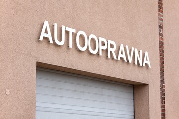 Generic "Car repair garage" sign written in Czech