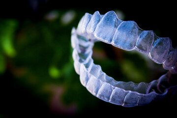 Invisible teeth aligner on light background