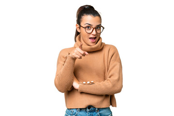 Fototapeta premium Young beauty woman over isolated chroma key background surprised and pointing front