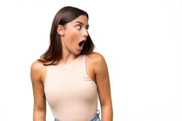 Young caucasian woman isolated on green chroma background doing surprise gesture while looking to the side