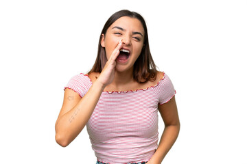 Young caucasian woman isolated on green chroma background shouting with mouth wide open