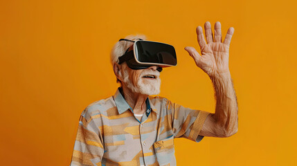 Waving Senior man wearing VR headset on orange background