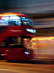 Zelfklevend Fotobehang fast moving Red bus © Gabriel